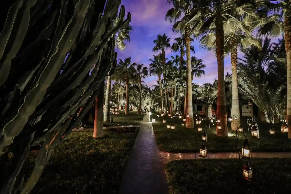 magical lush garden with candles evening event marrakech