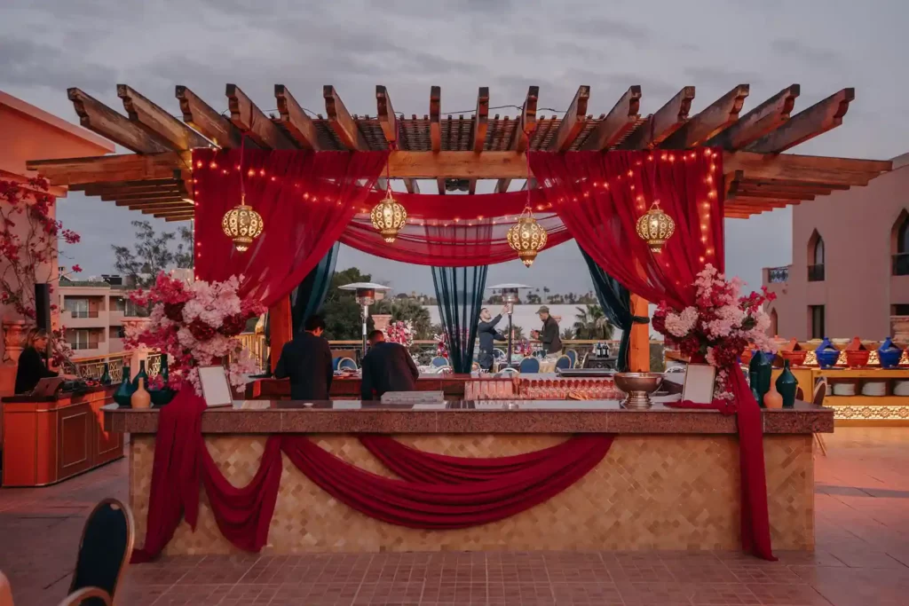 romantic bar setup red drapes lanterns event